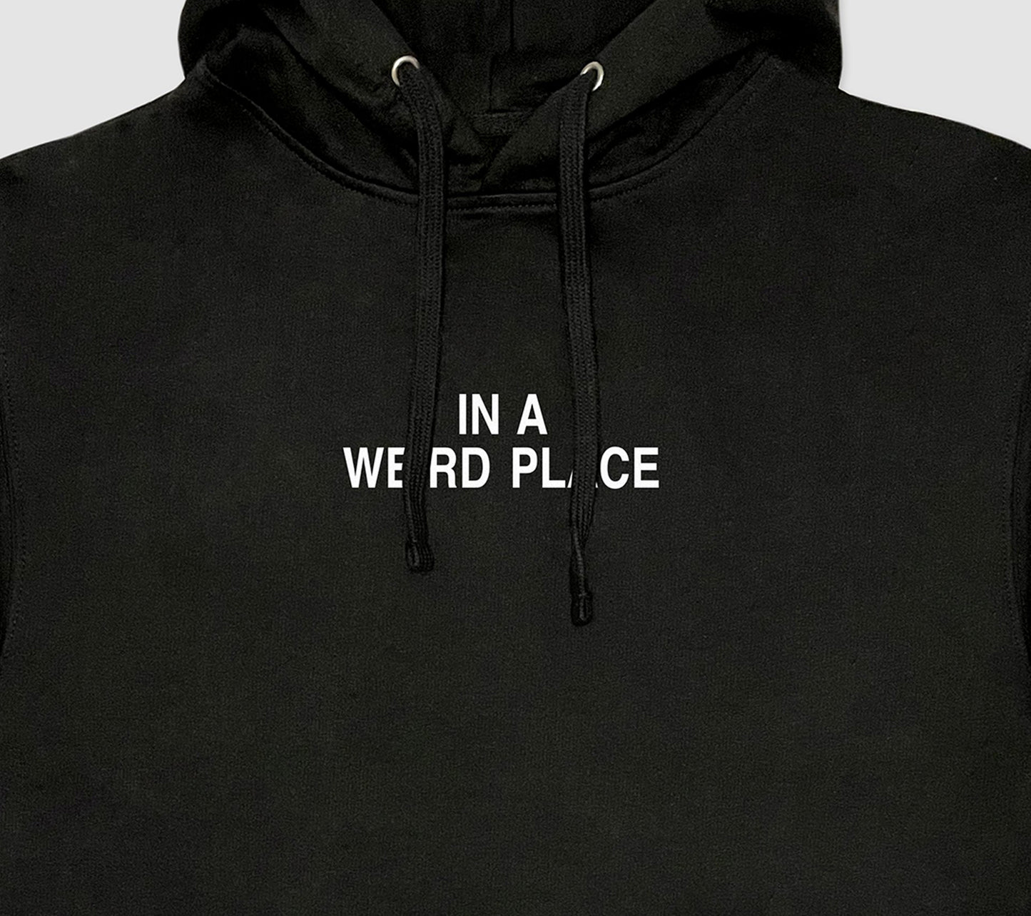 In A Weird Place Hoodie black